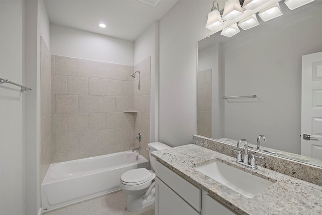 full bathroom with vanity, tiled shower / bath combo, toilet, and tile patterned floors