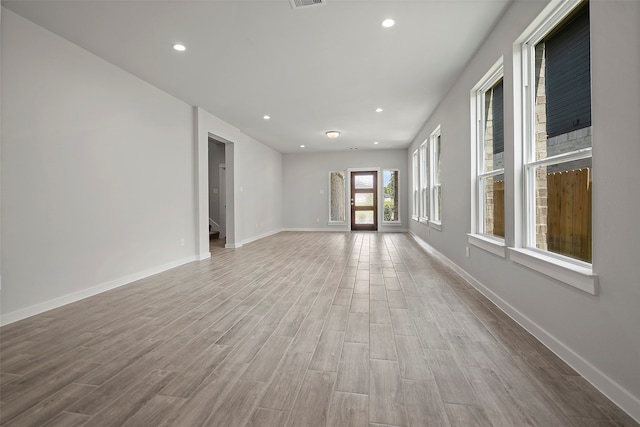 unfurnished living room featuring wood-type flooring