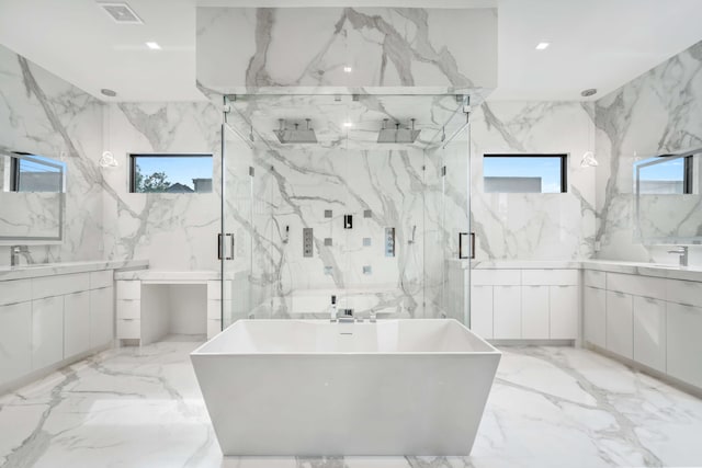 bathroom featuring tile walls, tile patterned floors, and vanity