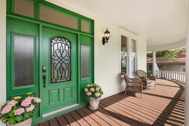 doorway to property featuring covered porch