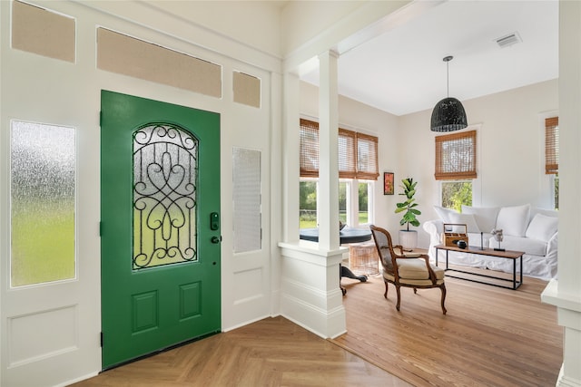 entrance foyer featuring decorative columns