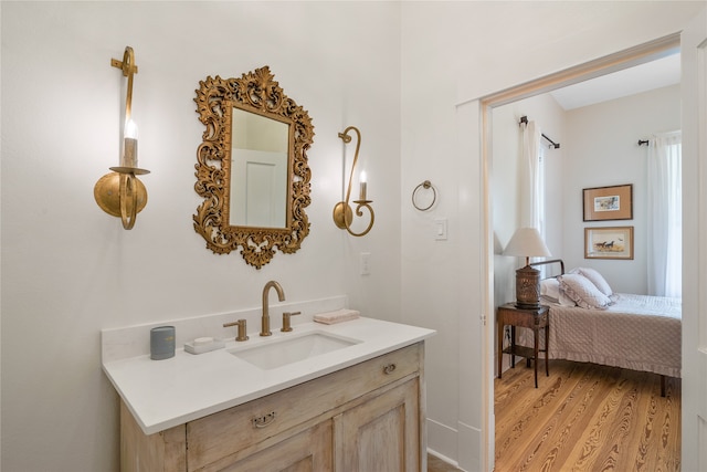 bathroom with vanity and hardwood / wood-style flooring