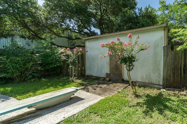 view of shed with fence