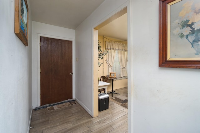 interior space with light wood-style flooring and baseboards