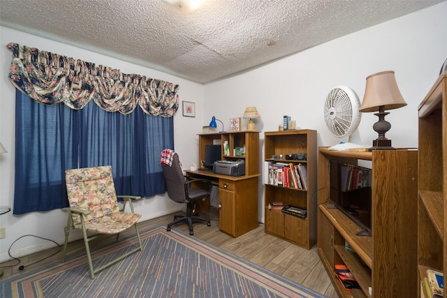 office area featuring a textured ceiling and wood finished floors