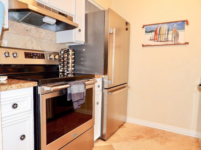 kitchen with light tile patterned floors, light stone countertops, white cabinetry, and stainless steel electric range