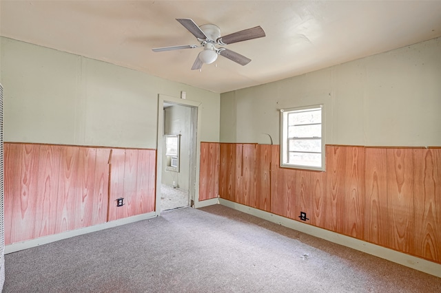 unfurnished room featuring carpet flooring and ceiling fan