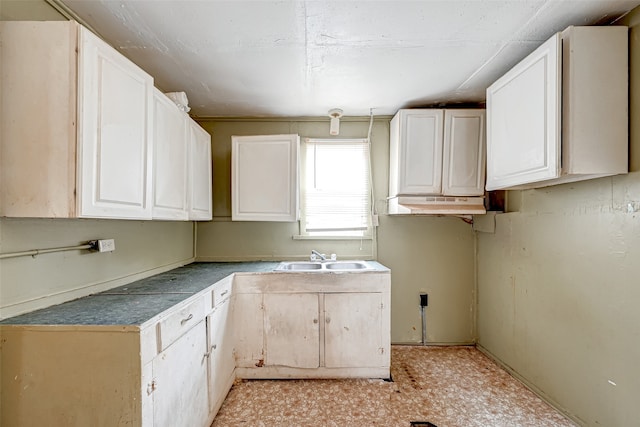 kitchen with sink and white cabinetry