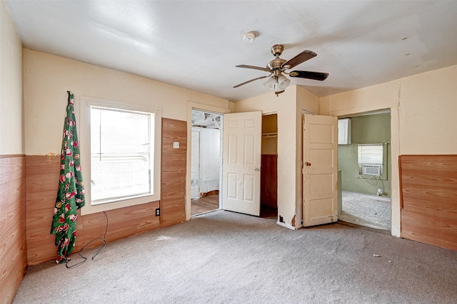 unfurnished bedroom featuring carpet flooring and ceiling fan