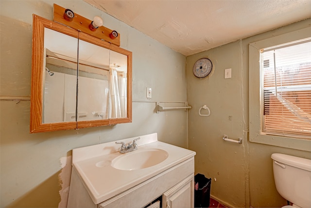 bathroom with oversized vanity and toilet