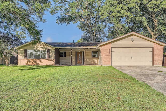 ranch-style home with a front yard and a garage