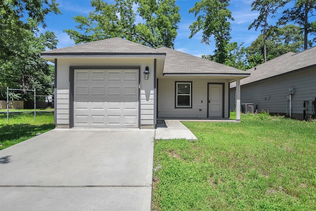 ranch-style home with a garage, a front yard, and cooling unit