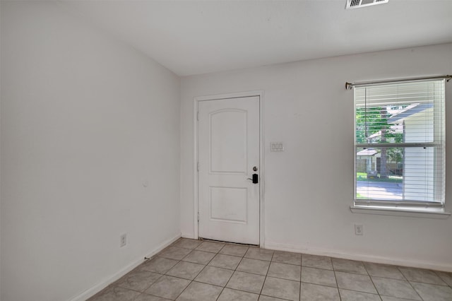 view of tiled spare room