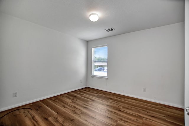 unfurnished room featuring wood-type flooring