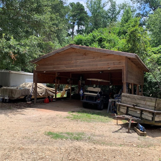 view of parking / parking lot with a carport