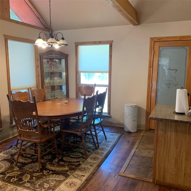 dining area featuring vaulted ceiling with beams, dark wood-type flooring, and a notable chandelier