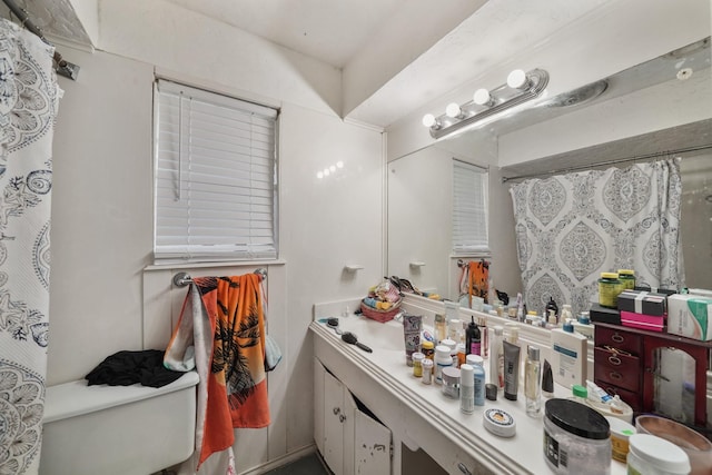 full bath featuring toilet and vanity