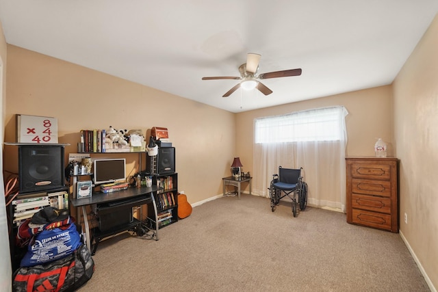 interior space with ceiling fan, carpet, and baseboards