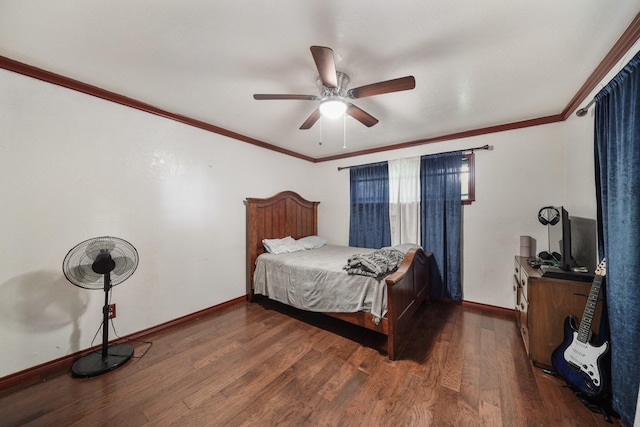 bedroom featuring a ceiling fan, crown molding, baseboards, and wood finished floors