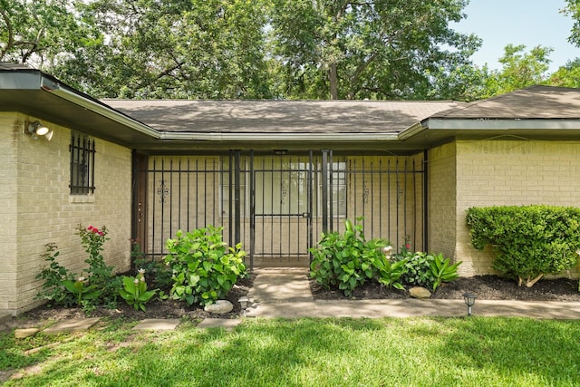 entrance to property with brick siding