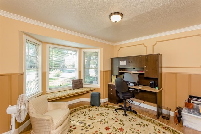 home office with crown molding, a textured ceiling, and light hardwood / wood-style flooring