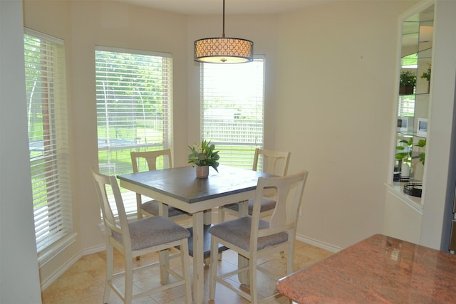 dining room featuring light tile patterned flooring