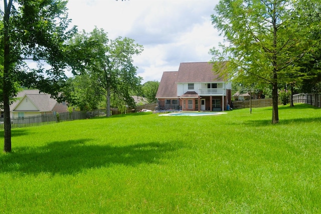 view of yard with a patio area and a balcony