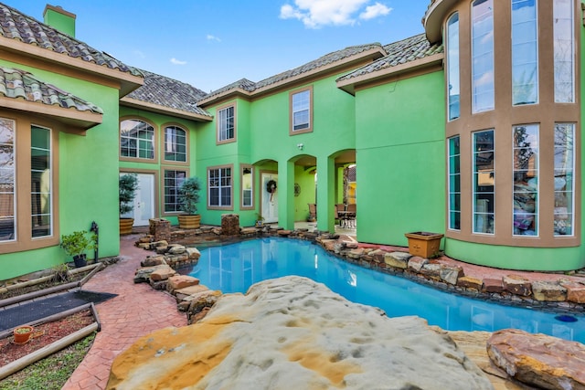 view of swimming pool featuring a patio