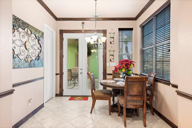 tiled dining room with a chandelier and crown molding