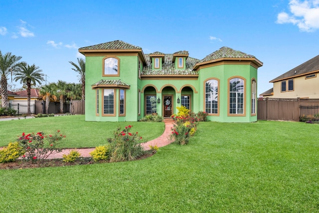 rear view of house featuring a lawn