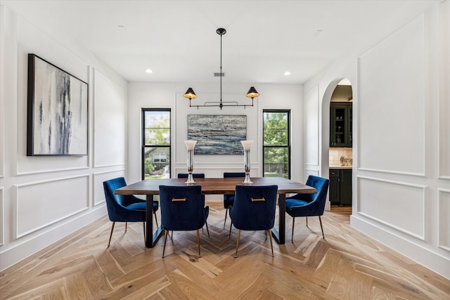 dining room with light parquet floors