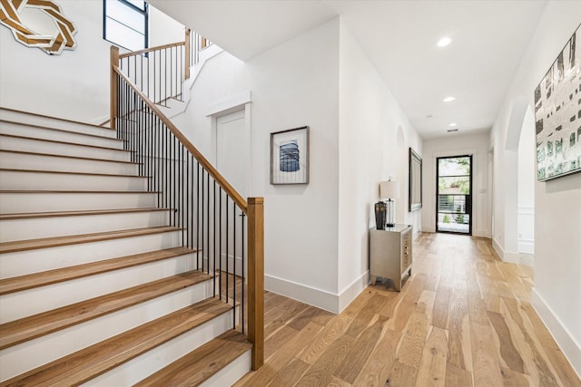 stairway featuring hardwood / wood-style flooring