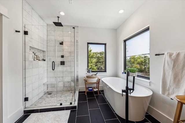 bathroom featuring tile patterned flooring and plus walk in shower