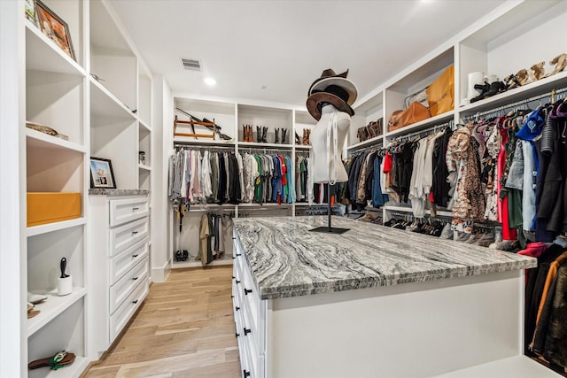 walk in closet featuring light wood-type flooring