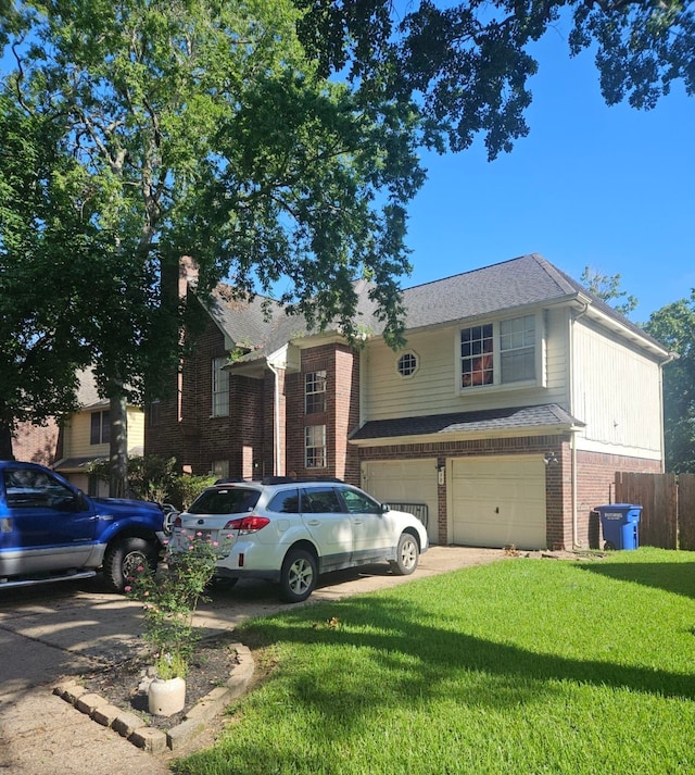 view of front facade with a garage and a front yard