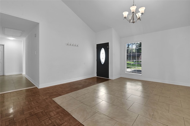 entryway with high vaulted ceiling, an inviting chandelier, and parquet flooring