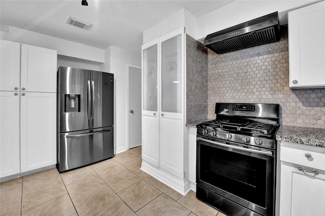 kitchen featuring white cabinetry, wall chimney range hood, and stainless steel appliances