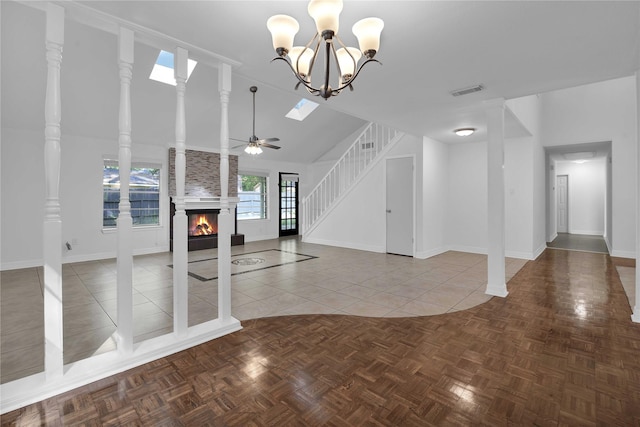 unfurnished living room featuring parquet flooring, a large fireplace, and ceiling fan