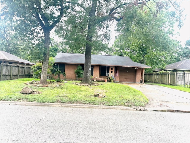 view of front of house featuring a front yard and a garage