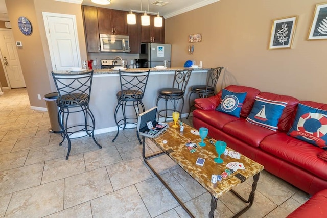 living room featuring crown molding