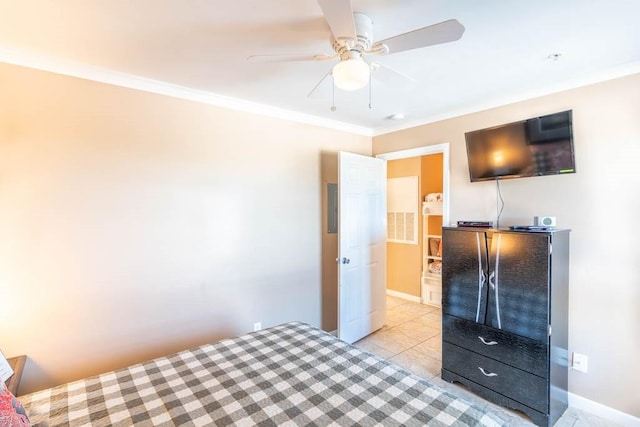 tiled bedroom featuring ornamental molding and ceiling fan