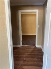 hall featuring dark wood-type flooring