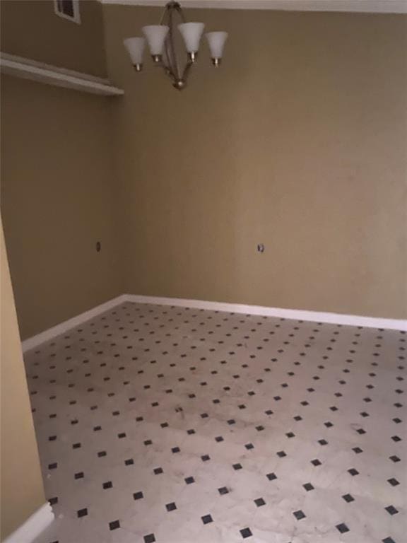 unfurnished dining area with an inviting chandelier