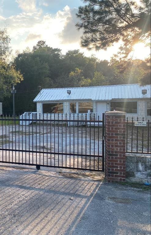 view of gate at dusk