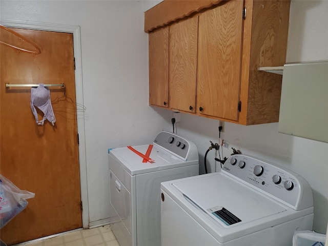 laundry area with cabinets and washer and dryer