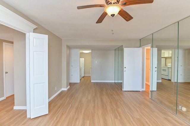 empty room featuring ceiling fan and light hardwood / wood-style flooring