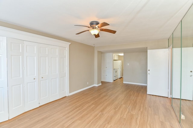 unfurnished bedroom with ceiling fan, light hardwood / wood-style flooring, and white fridge