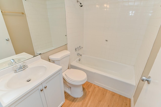 full bathroom with vanity, toilet, wood-type flooring, and shower / tub combination