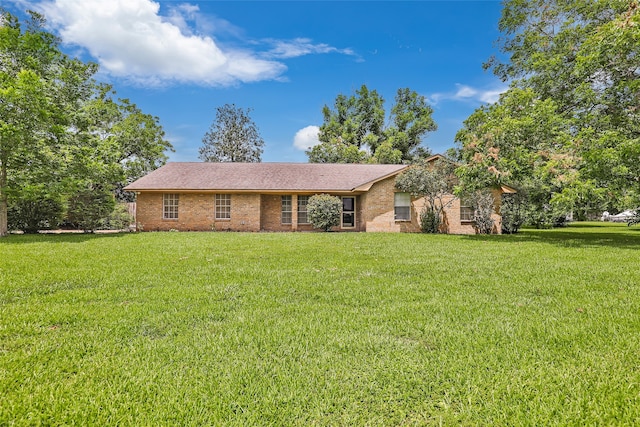 ranch-style house with a front lawn