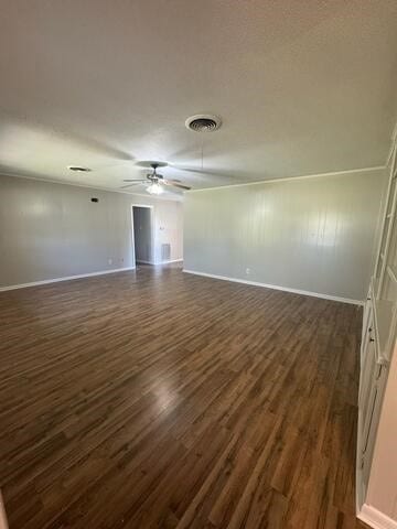 unfurnished room with dark hardwood / wood-style flooring